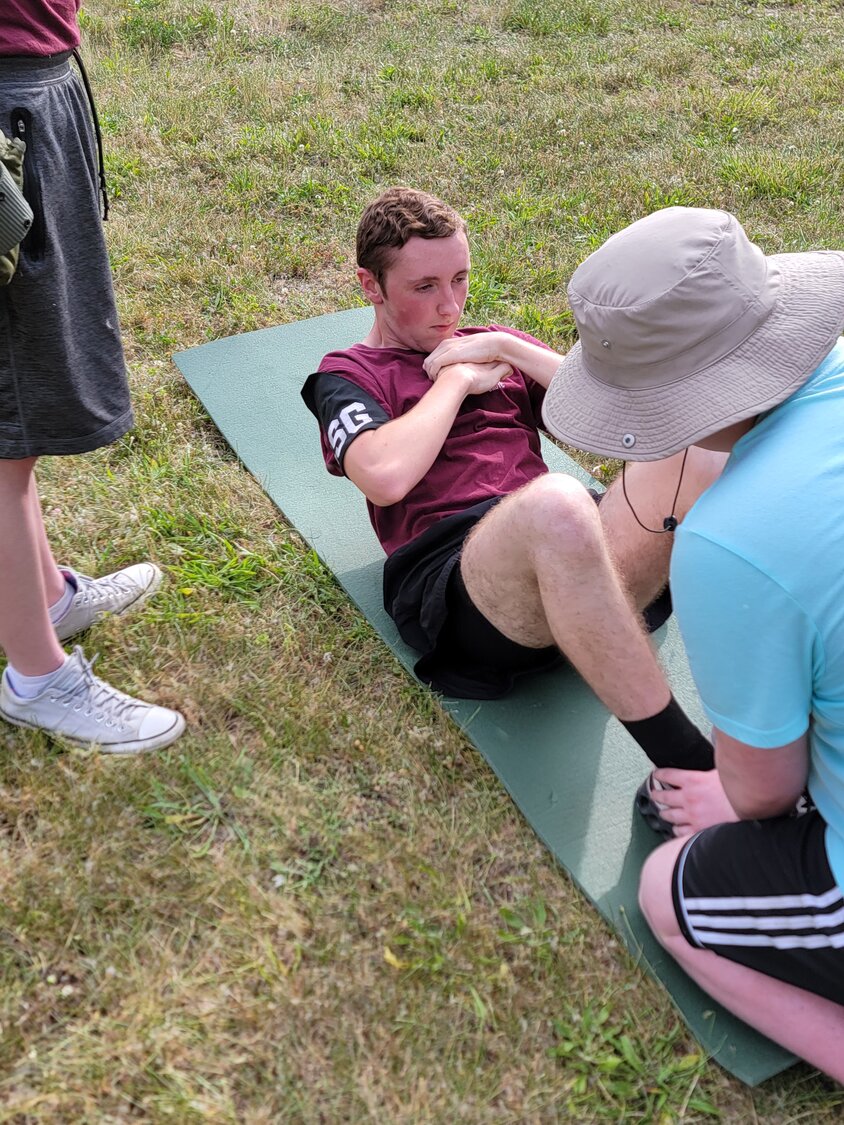 Cadet Jayden Keith conducts sit-ups during the physical fitness test.